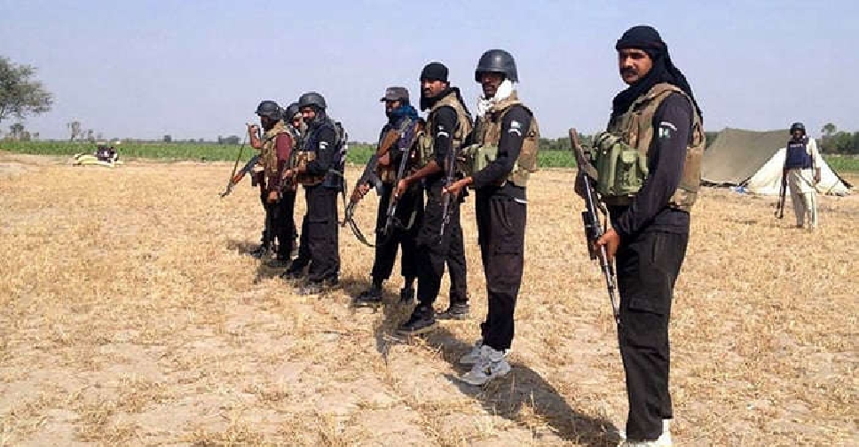 kill at least 11 Pakistani police officers