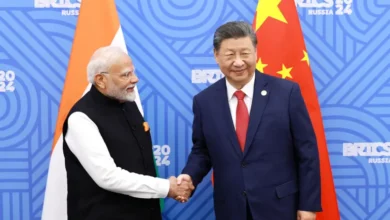 Modi meets Xi as India
